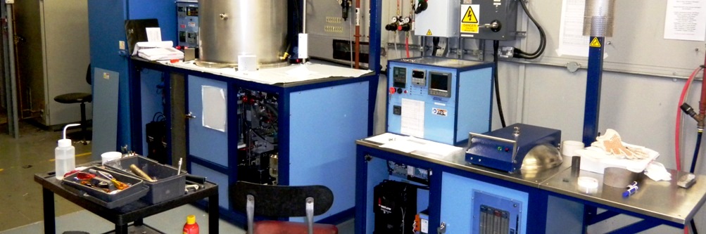 A JVAC 18x48 High Vacuum / hydrogen Combination furnace next to a B-16 Hydrogen coldwall furnace